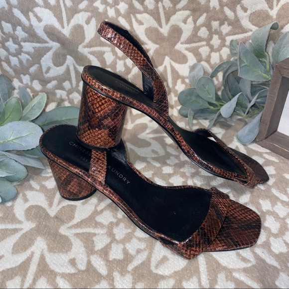 Maroon and black Snake print heels. - Picture 1 of 4